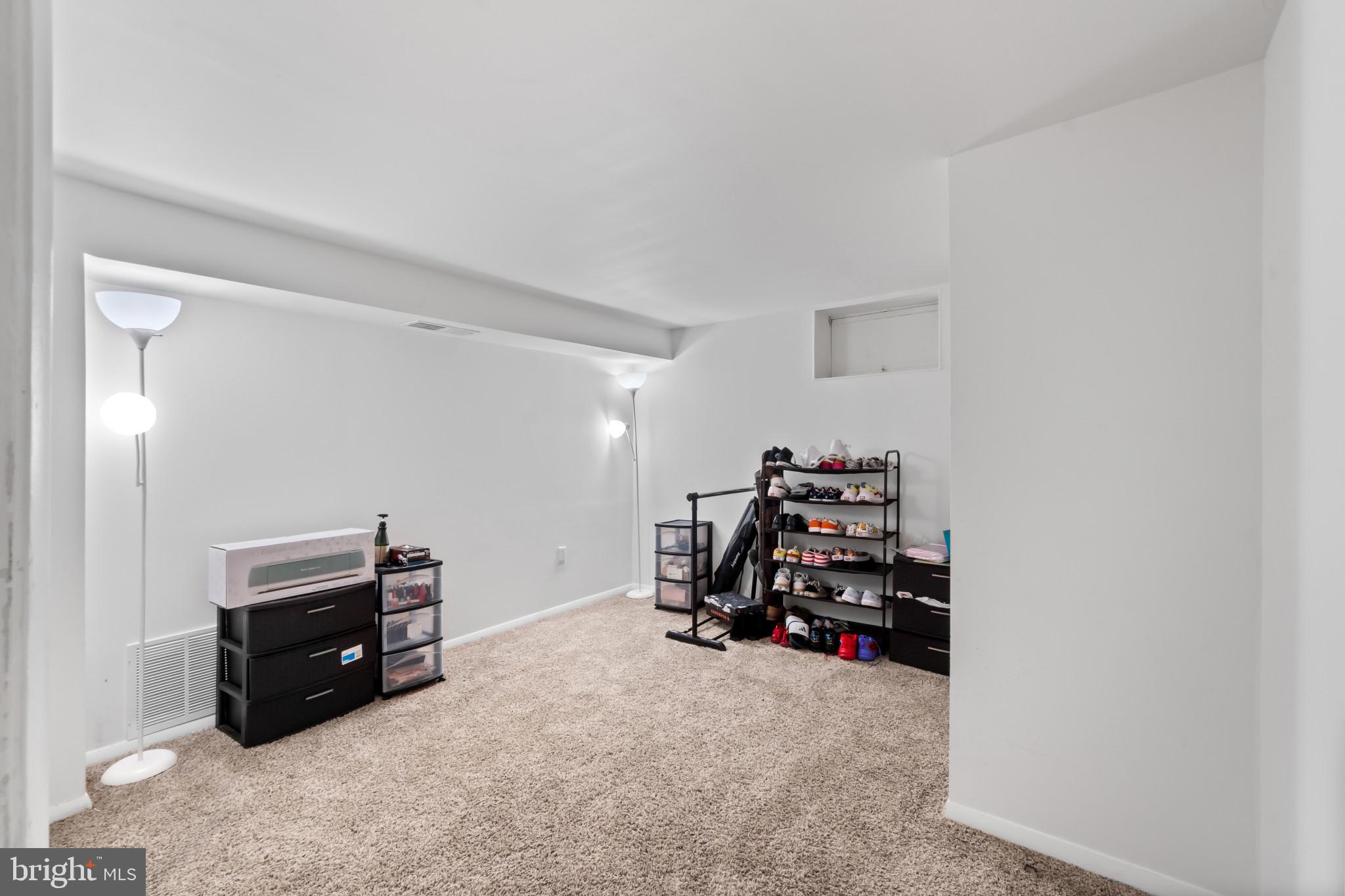 415 Baylor Road Glen Burnie, MD 21061 - Photo 16 of 29 a view of a room with furniture and clutter
