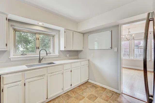 a kitchen with a sink and cabinets