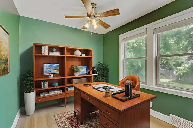 a living room with furniture pool table and a large window