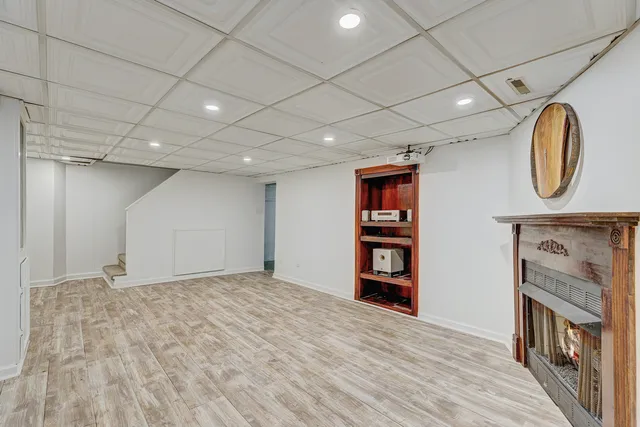 a bathroom with a sink mirror vanity and toilet