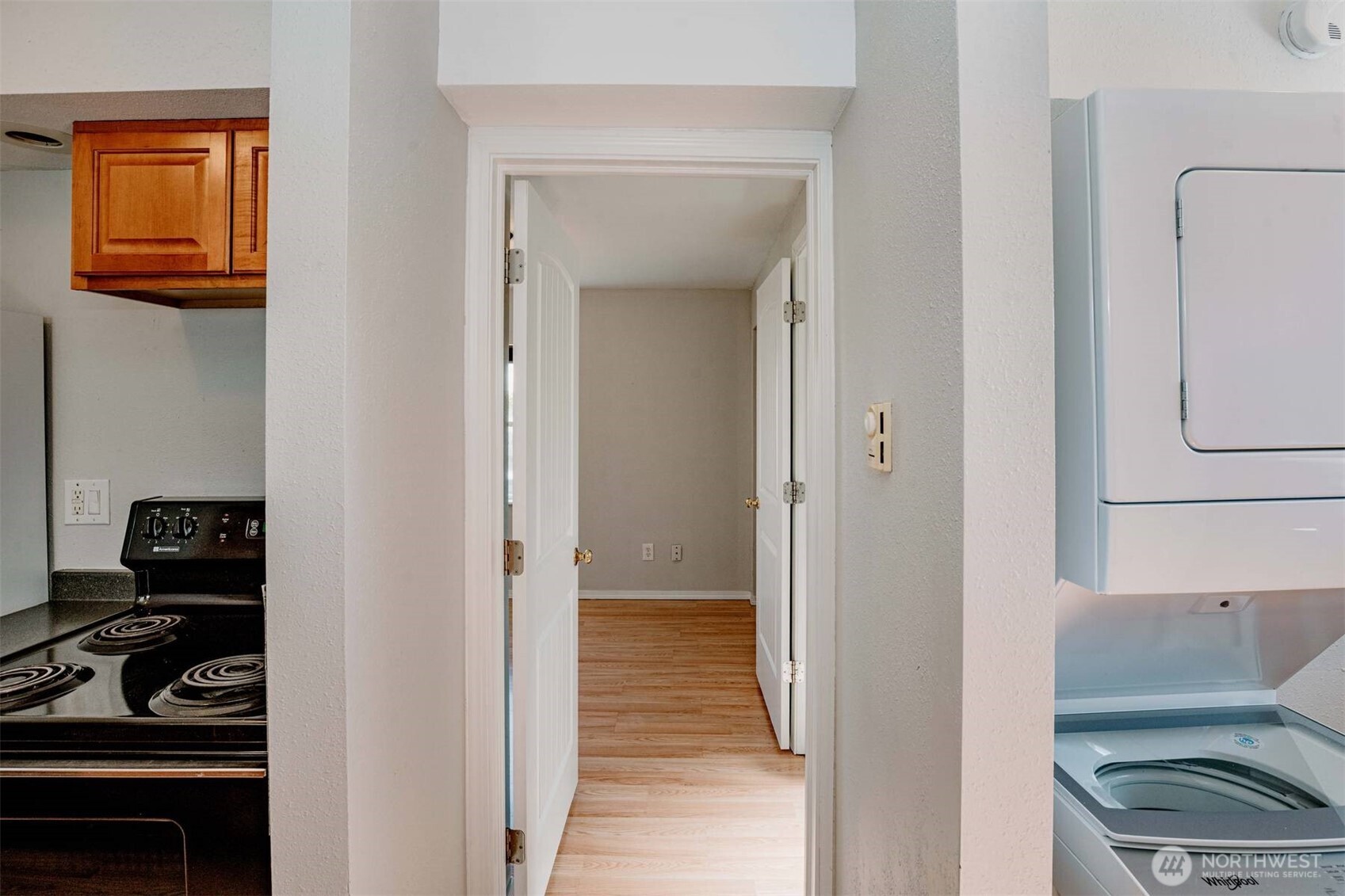 2220 Summit Avenue Everett, WA 98201 - Photo 8 of 26 a view of a hallway with wooden floor and a closet