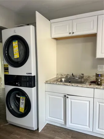 a kitchen with a stove and cabinets