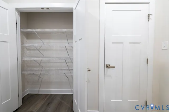 a kitchen with stainless steel appliances a refrigerator and cabinets