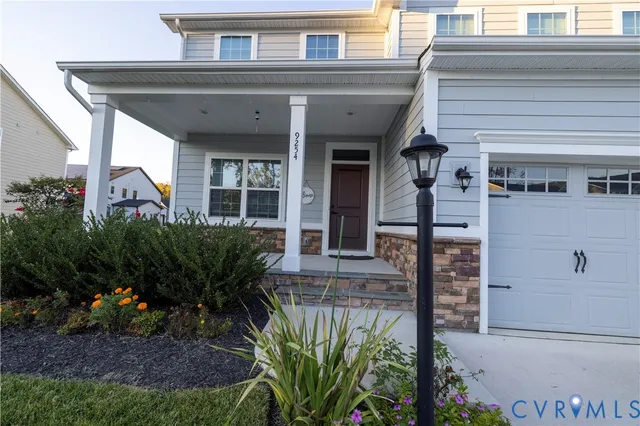 a view of a house with potted plants