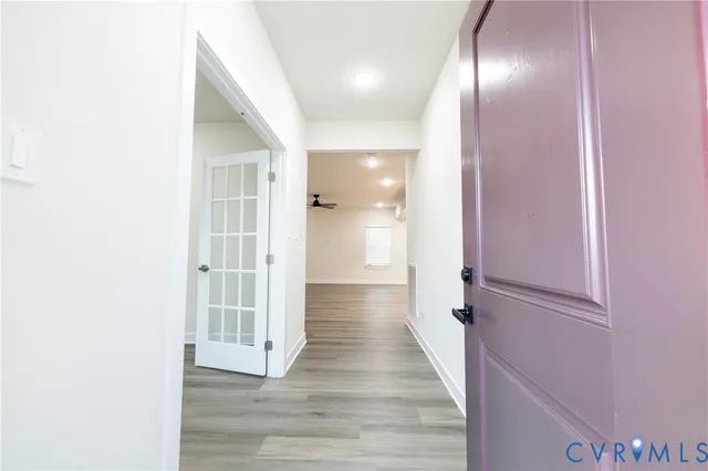 a view of gallery with wooden floor