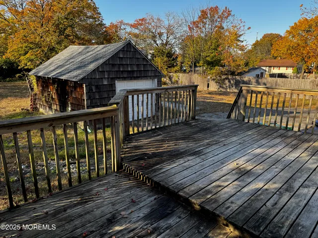 a view of a wooden deck and a lake view