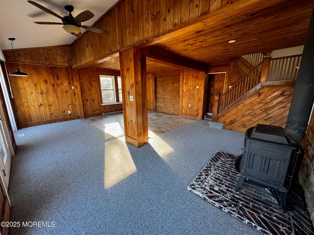a view of staircase with a rug