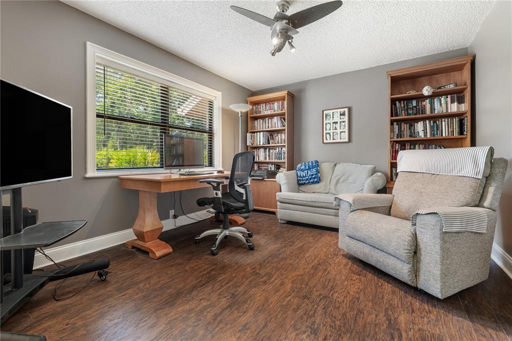 3372 Brian Road South Palm Harbor, FL 34685 - Photo 32 of 45 a living room with furniture and a flat screen tv