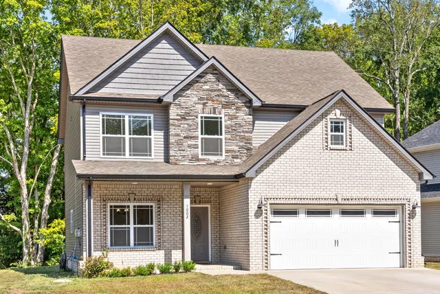 a view of house with yard