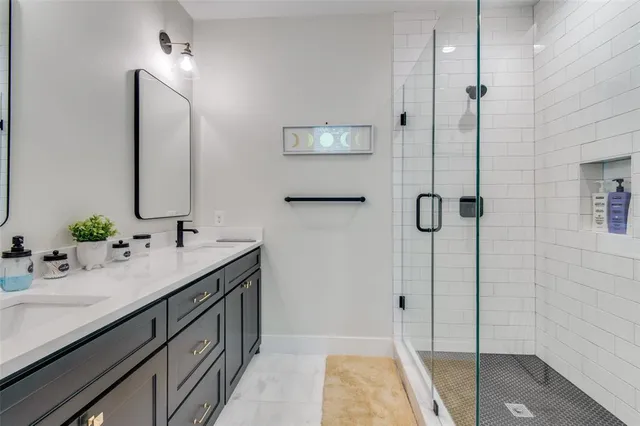 a bathroom with a tub sink and mirror