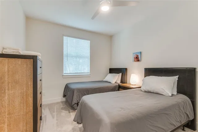 a bedroom with bed and window