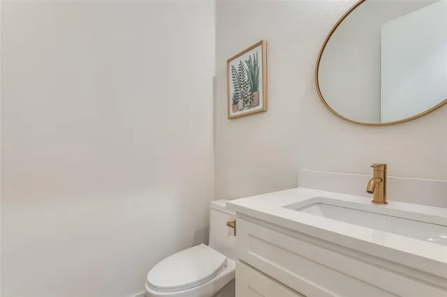 a bathroom with a toilet and a sink