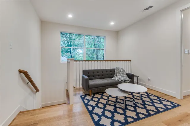 a living room with furniture and a rug
