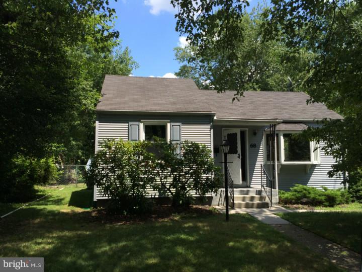 68 Stanford Road Cherry Hill, NJ 08034 - Photo 2 of 4 a front view of a house with a garden