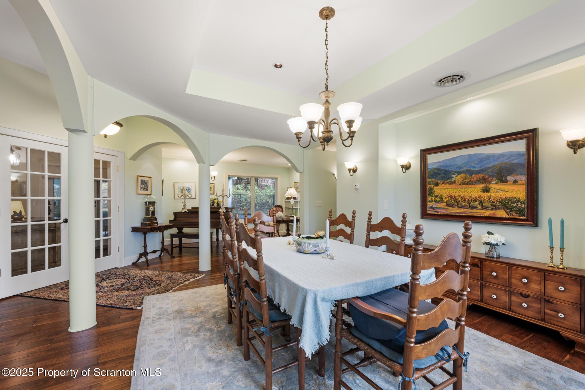 118 Autumn View Lane Factoryville, PA 18419 - Photo 15 of 28 a view of a dining room with furniture a chandelier and wooden floor