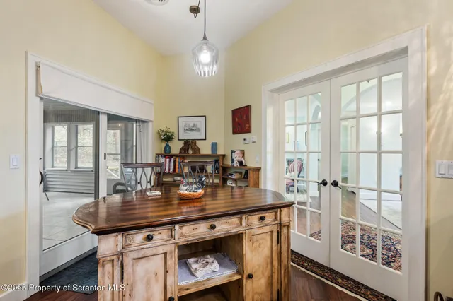 a view of a dining room with furniture and chandelier