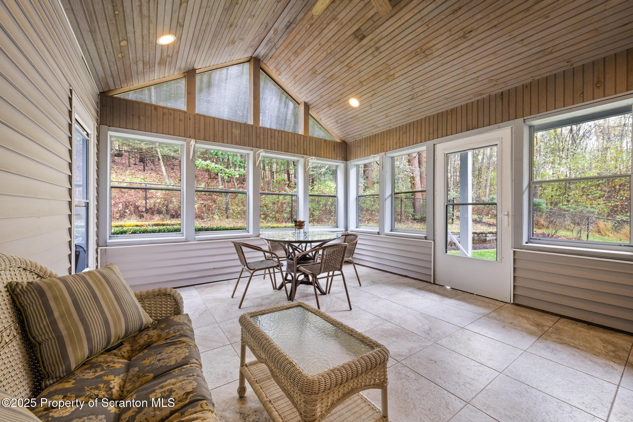 118 Autumn View Lane Factoryville, PA 18419 - Photo 21 of 28 a dining room with furniture a chandelier and wooden floor