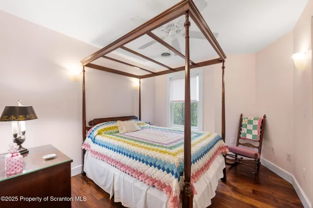 a bed room with a bed and a window