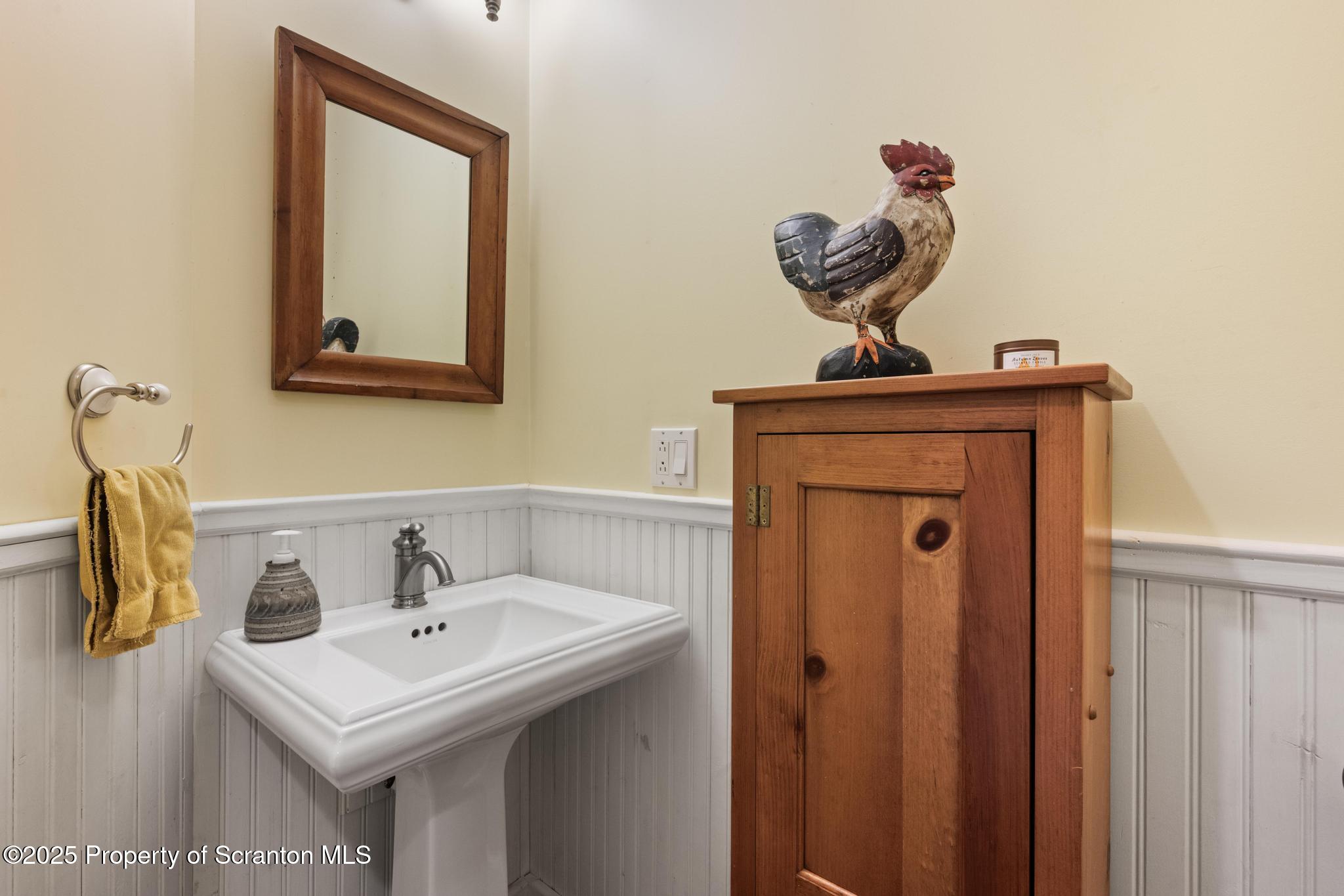118 Autumn View Lane Factoryville, PA 18419 - Photo 27 of 28 a bathroom with a sink and a mirror