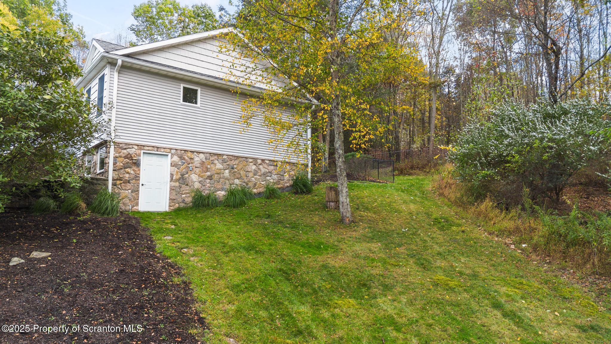 118 Autumn View Lane Factoryville, PA 18419 - Photo 5 of 28 a backyard of a house with lots of green space