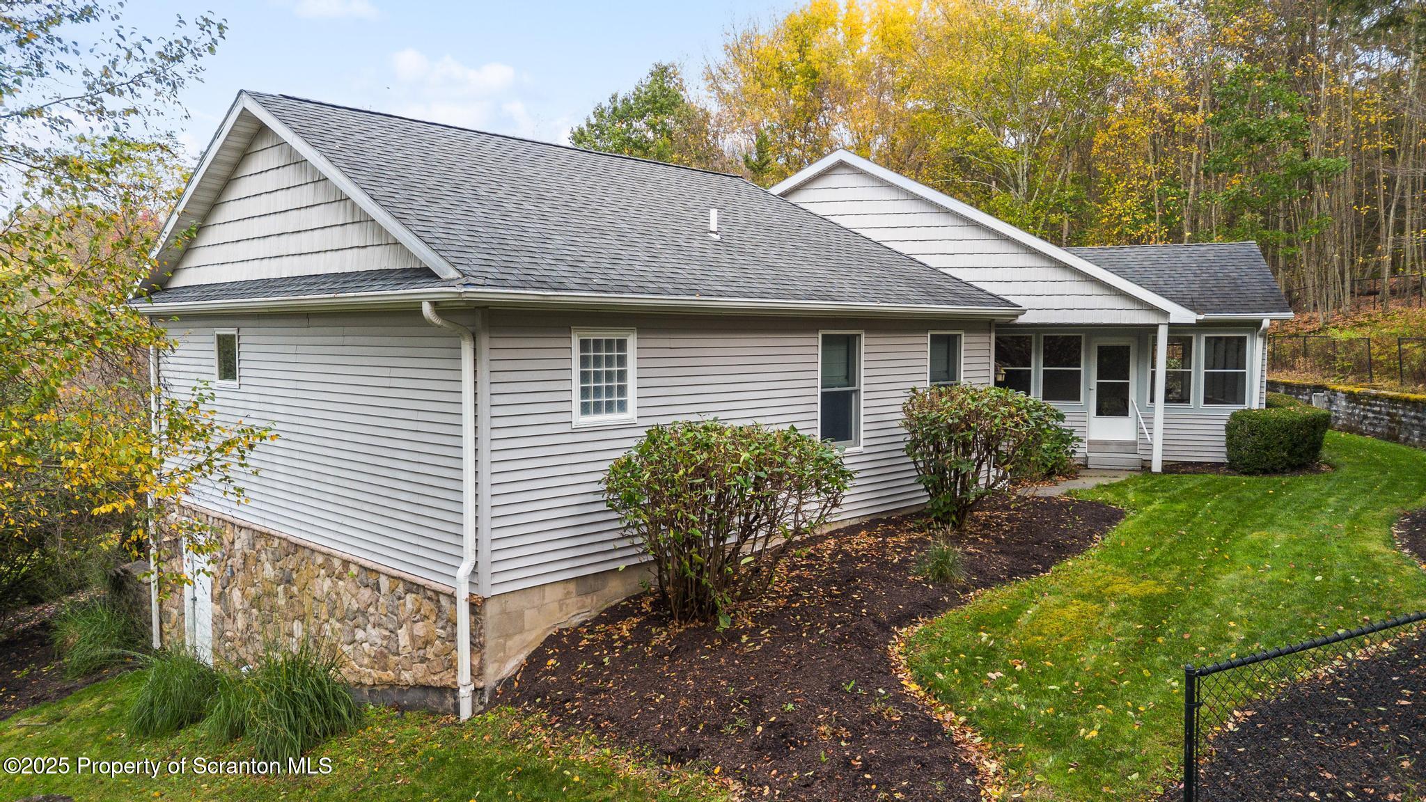 118 Autumn View Lane Factoryville, PA 18419 - Photo 6 of 28 a front view of house with yard and outdoor seating