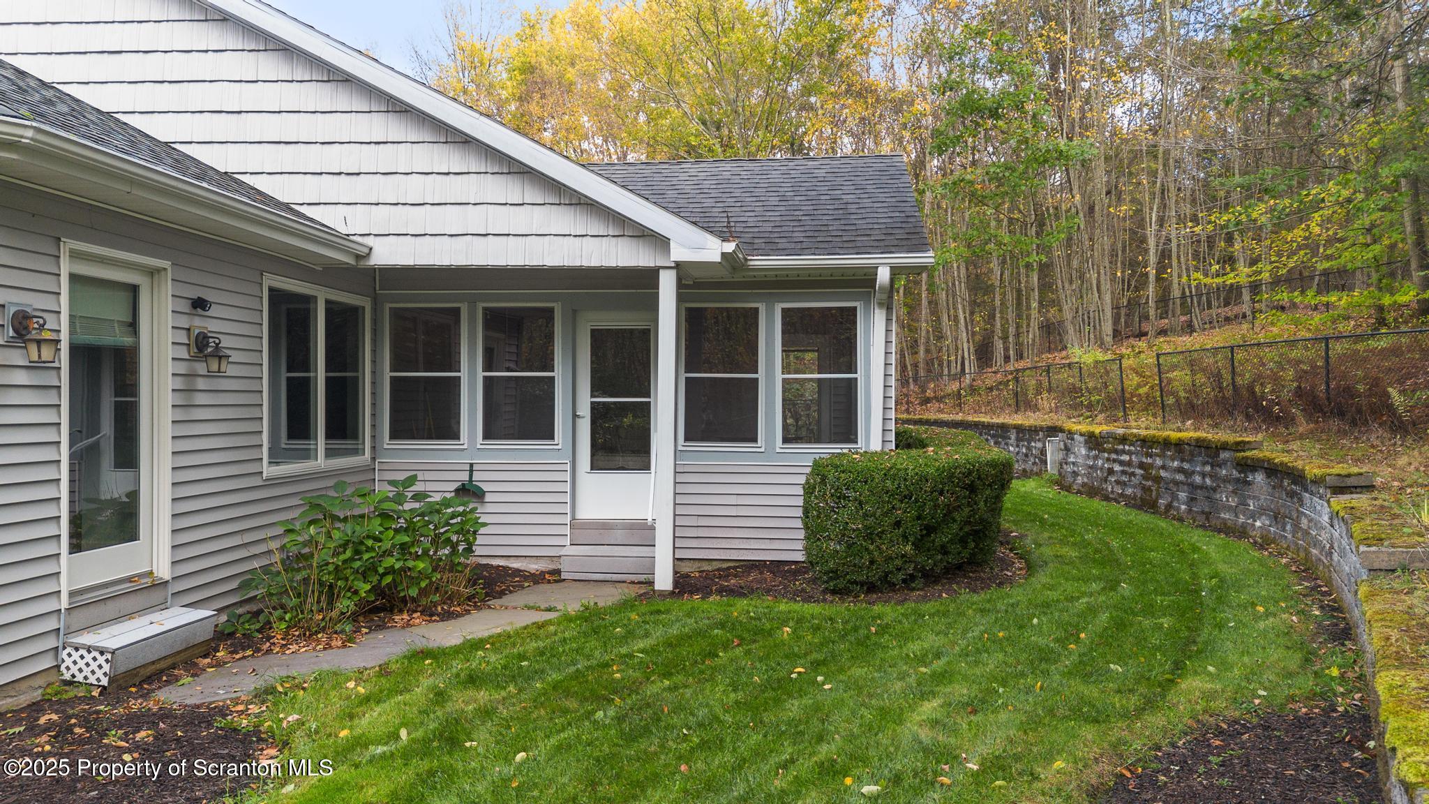 118 Autumn View Lane Factoryville, PA 18419 - Photo 8 of 28 a front view of a house with a garden