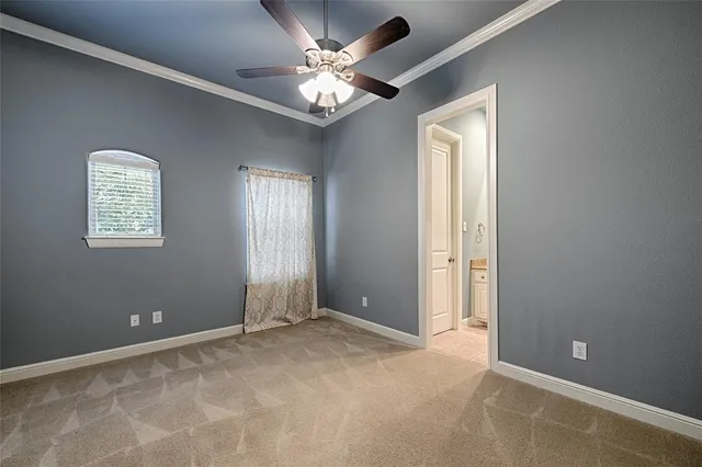 a view of a livingroom with a chandelier fan