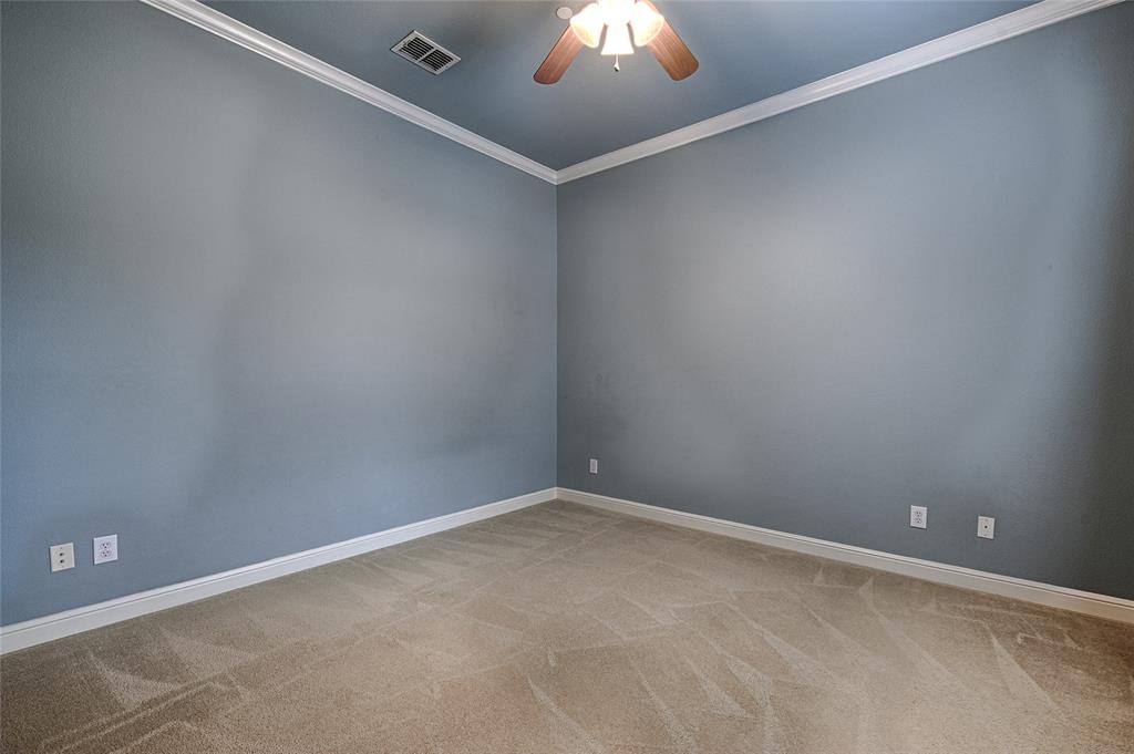 8329 Moore Street Frisco, TX 75034 - Photo 21 of 30 Spare room with crown molding, ceiling fan, and light colored carpet