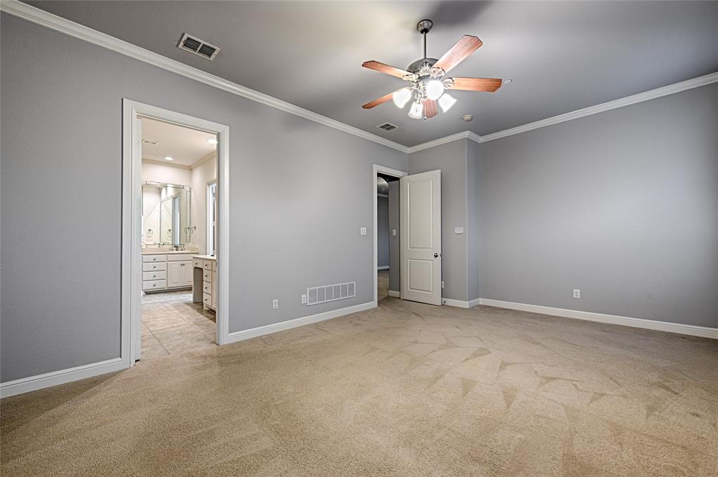 8329 Moore Street Frisco, TX 75034 - Photo 27 of 30 Unfurnished bedroom featuring ornamental molding, light carpet, a ceiling fan, and ensuite bathroom