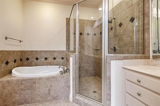 a bath tub sitting next to a bathroom shower