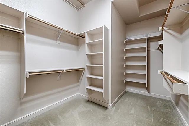 a view of an empty walk in closet