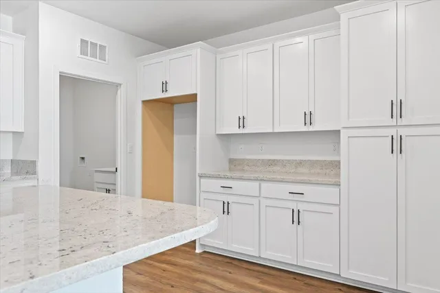 a view of cabinets with wooden floor