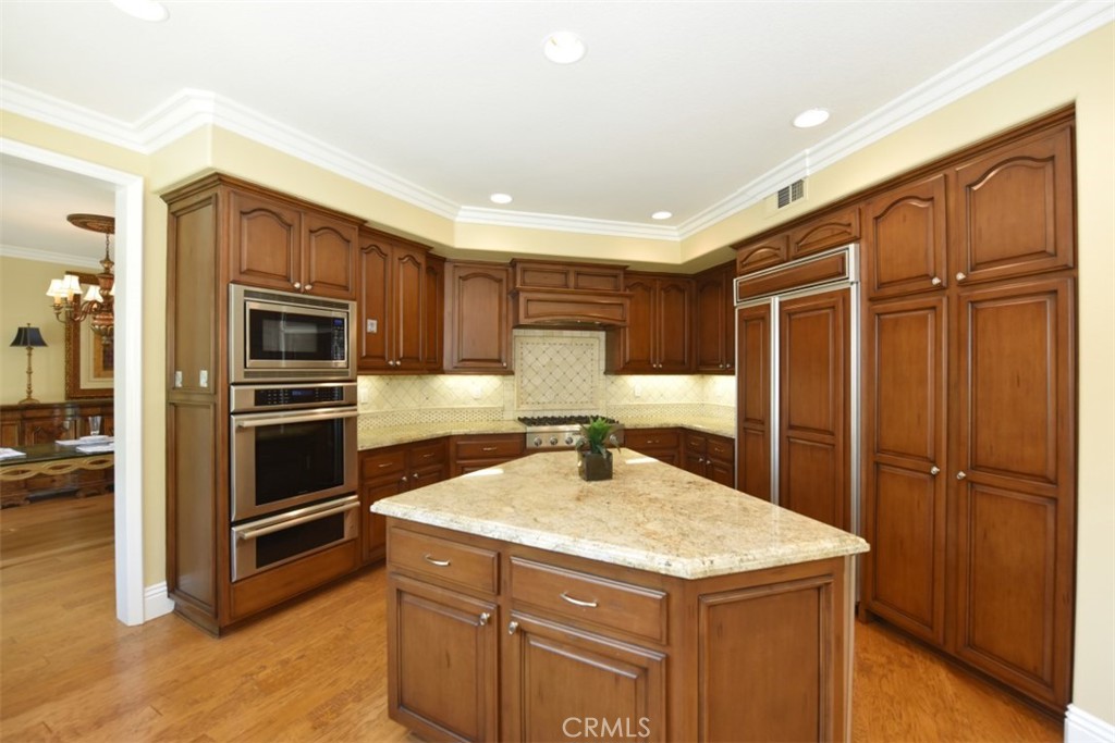 12 Brigadier Irvine, CA 92603 - Photo 21 of 50 a kitchen with a refrigerator and a sink