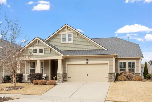 a front view of a house with yard