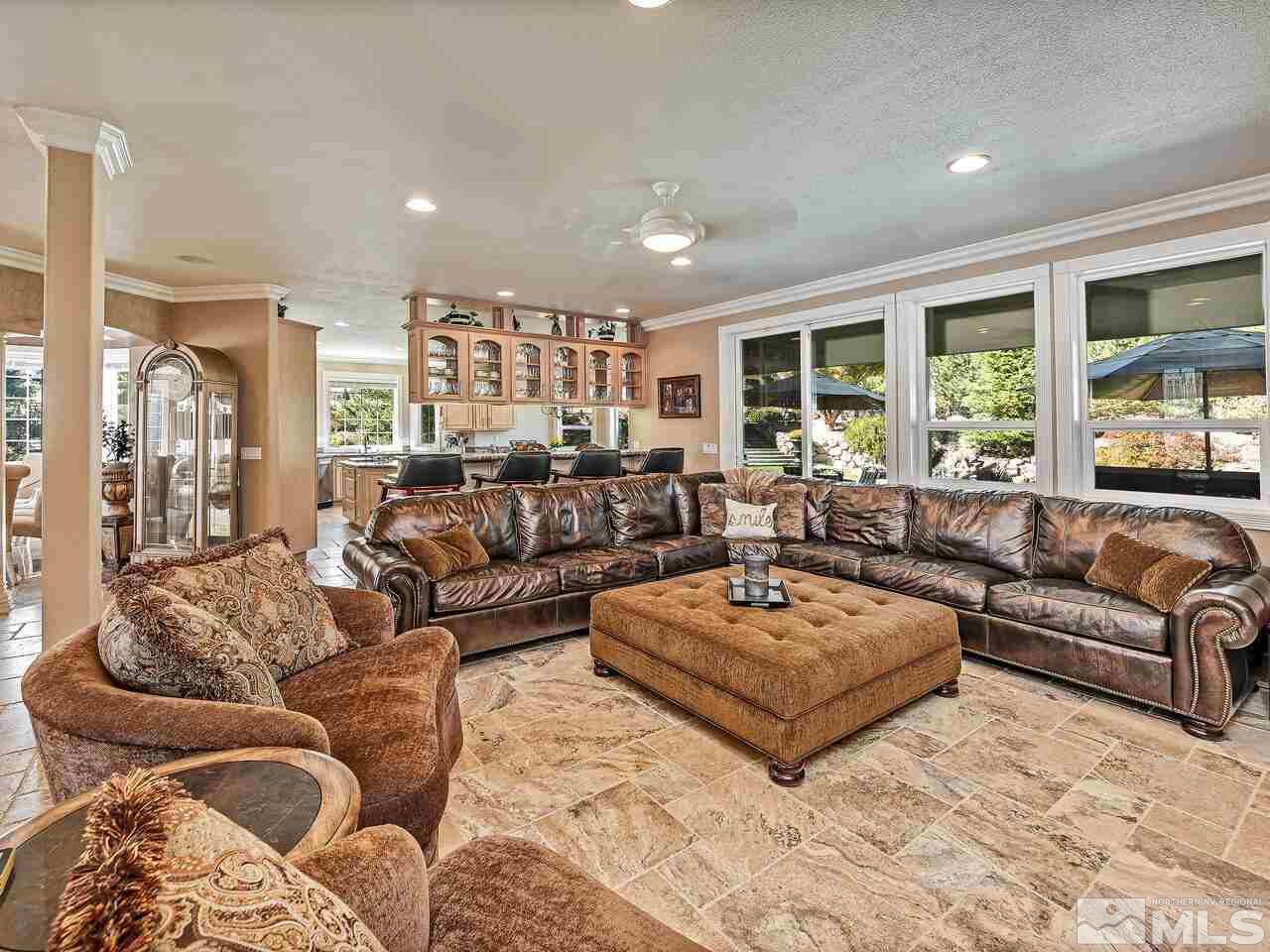 13215 West Saddlebow Drive Reno, NV 89511 - Photo 11 of 32 a living room with furniture and a large window