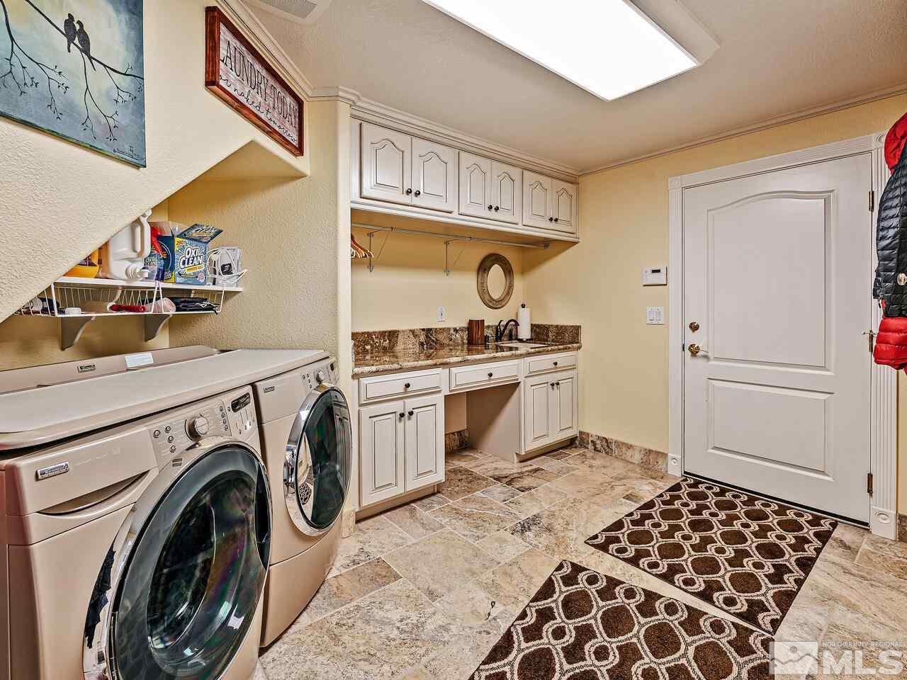13215 West Saddlebow Drive Reno, NV 89511 - Photo 17 of 32 a view of a kitchen with washer and dryer