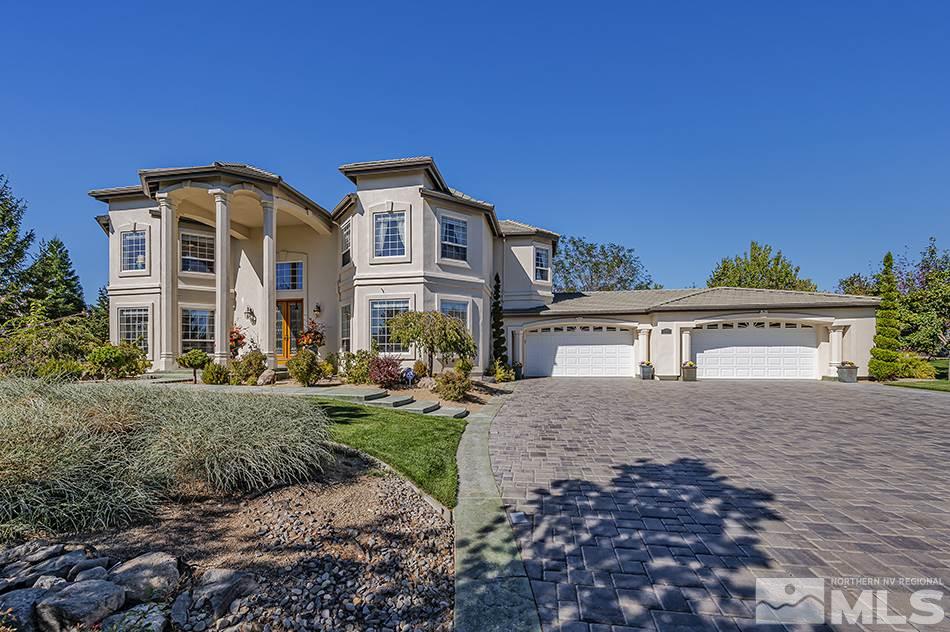 13215 West Saddlebow Drive Reno, NV 89511 - Photo 2 of 32 a front view of a house with yard