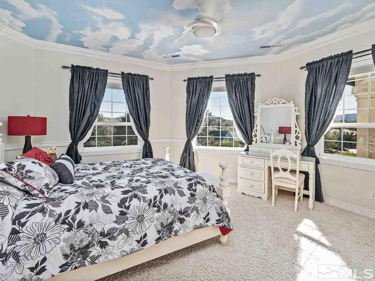 13215 West Saddlebow Drive Reno, NV 89511 - Photo 21 of 32 a bedroom with a bed and a window