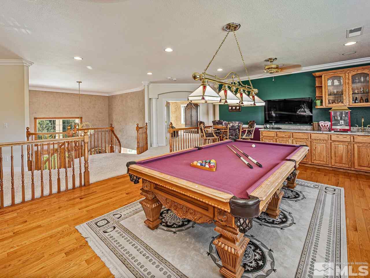 13215 West Saddlebow Drive Reno, NV 89511 - Photo 26 of 32 a room with pool table and flat screen tv