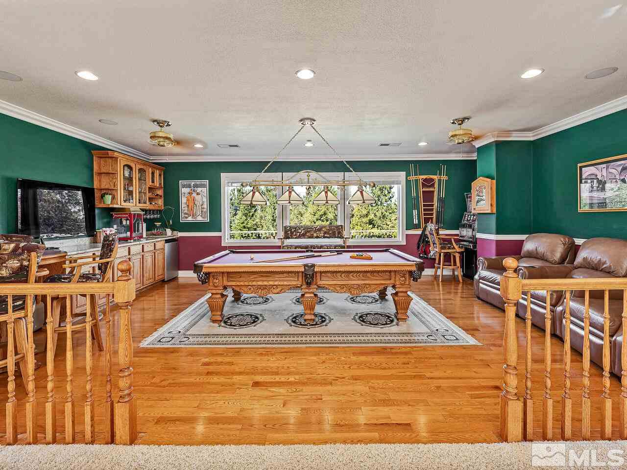 13215 West Saddlebow Drive Reno, NV 89511 - Photo 27 of 32 a living room with furniture a rug and a large window