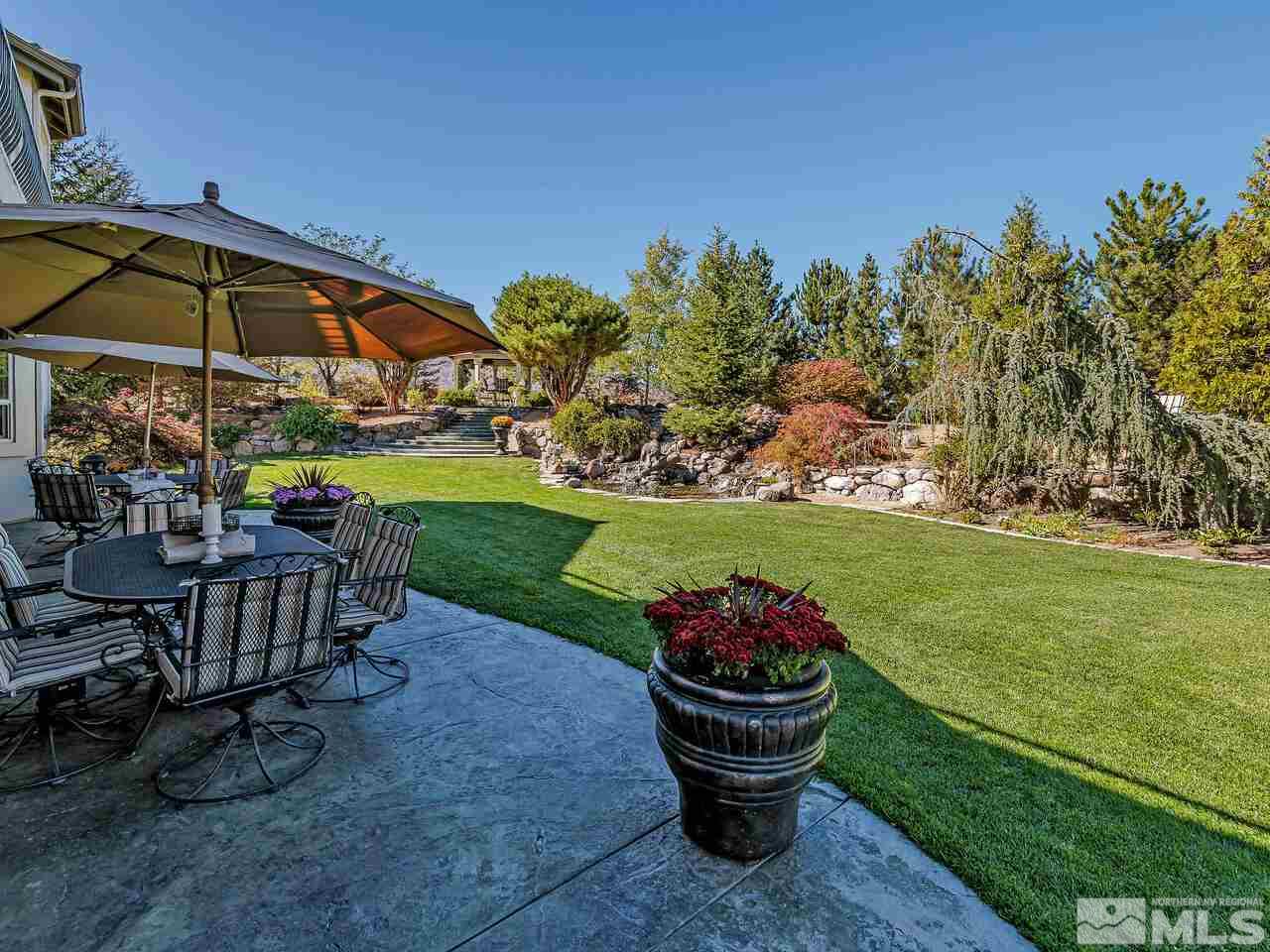 13215 West Saddlebow Drive Reno, NV 89511 - Photo 31 of 32 a view of a chair and table on the garden