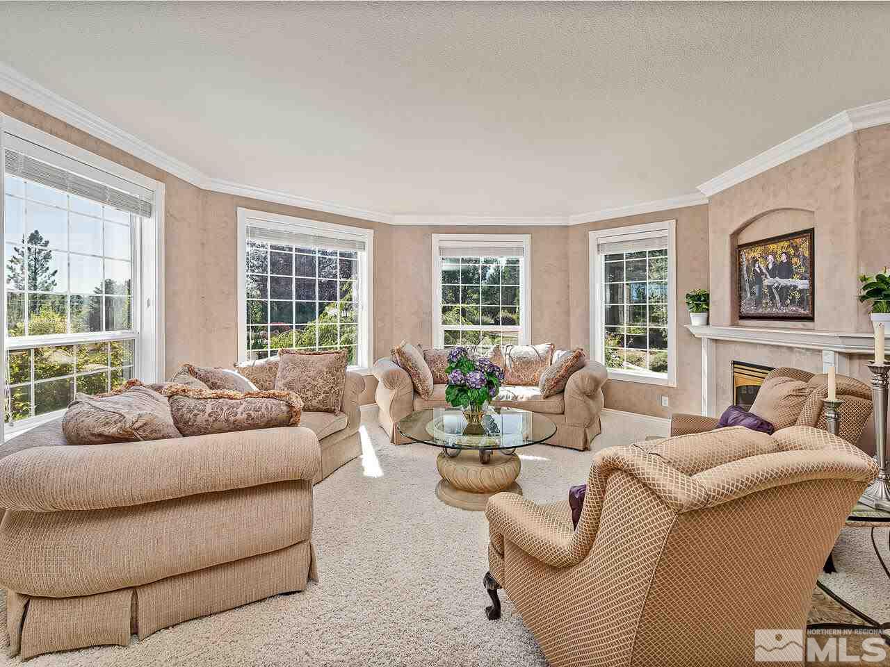 13215 West Saddlebow Drive Reno, NV 89511 - Photo 8 of 32 a living room with furniture and floor to ceiling windows