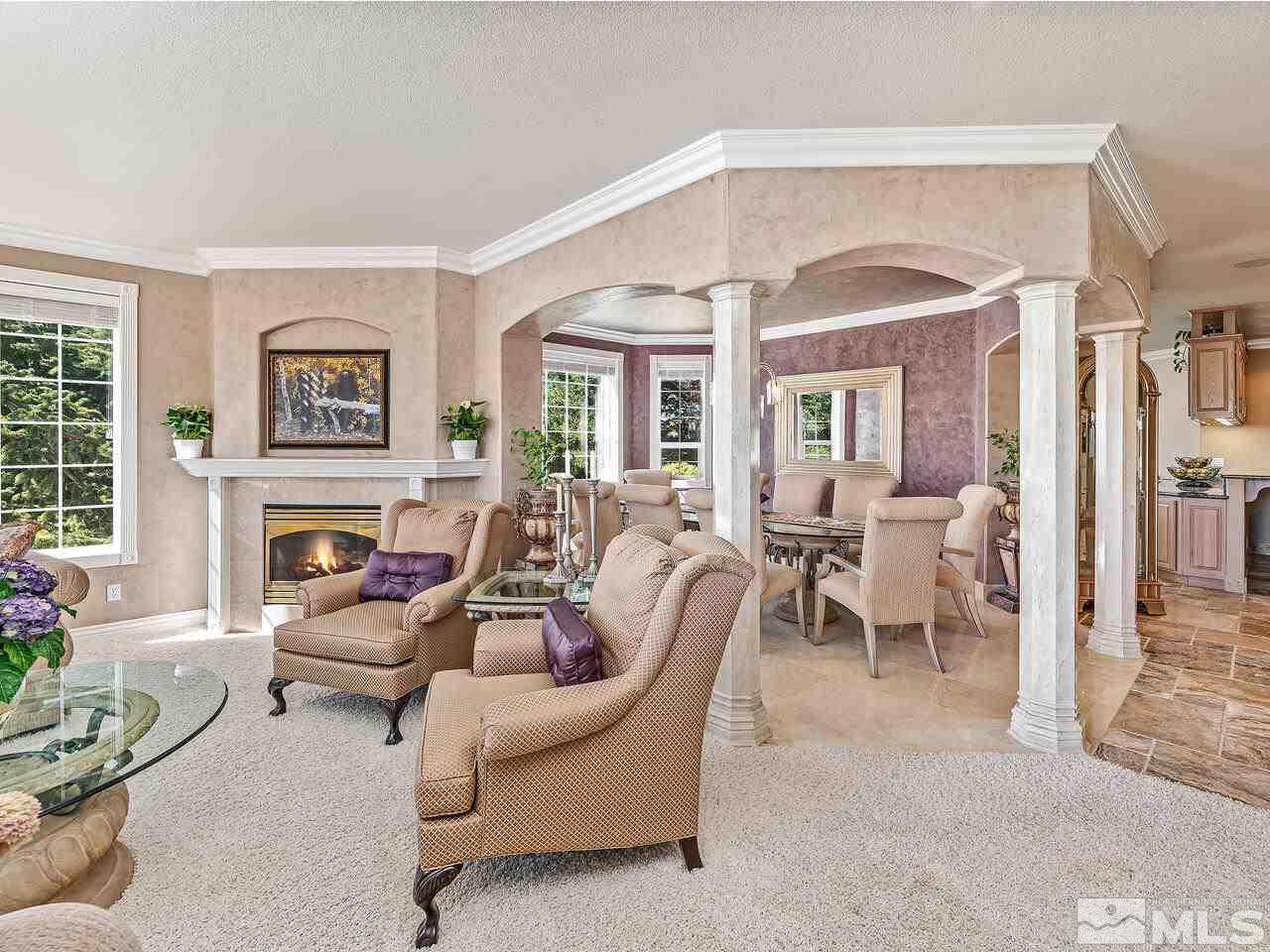 13215 West Saddlebow Drive Reno, NV 89511 - Photo 9 of 32 a living room with furniture two window and a fireplace