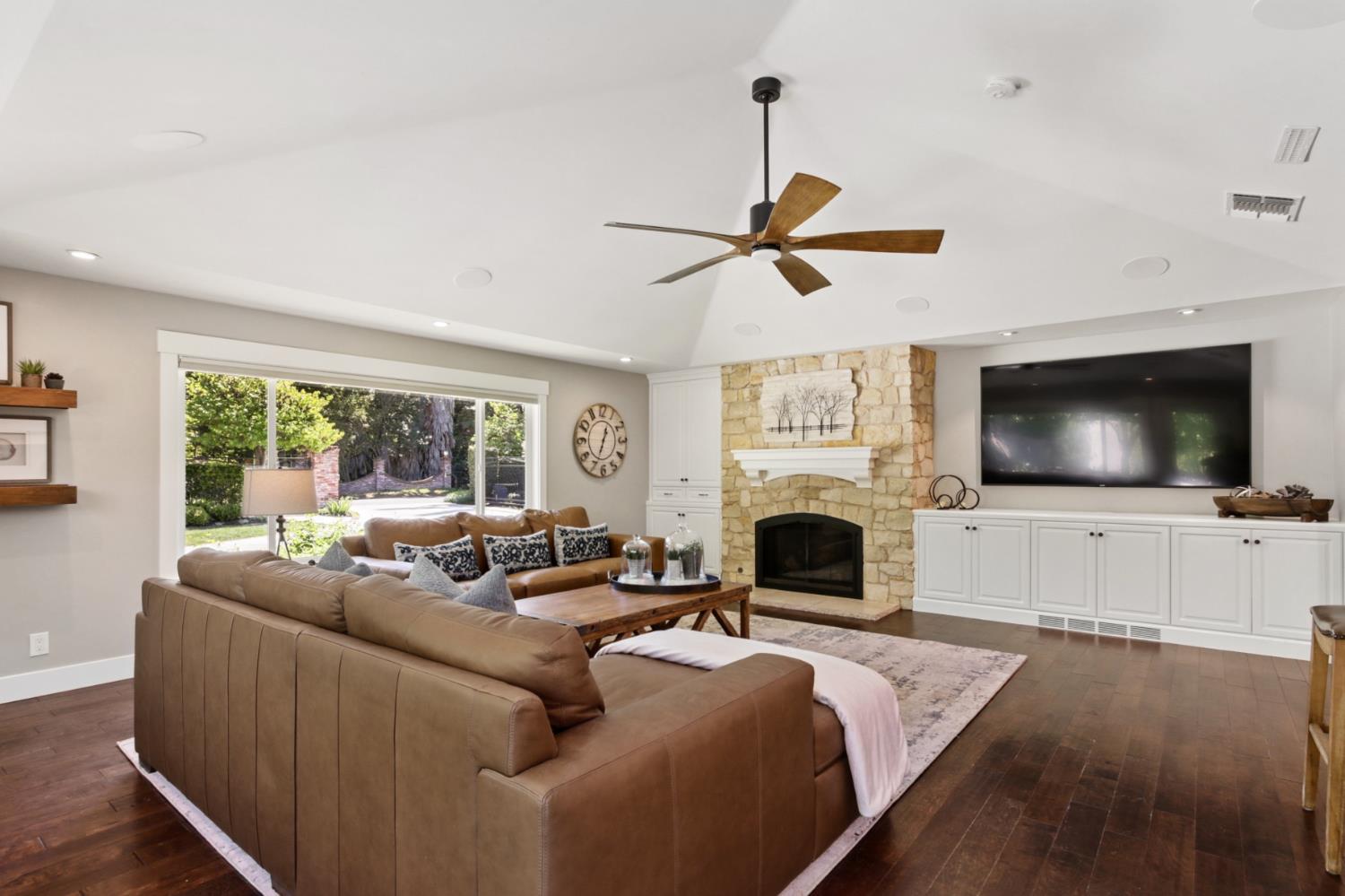 495 Bret Harte Road Sacramento, CA 95864 - Photo 15 of 84 a living room with furniture a flat screen tv and a fireplace