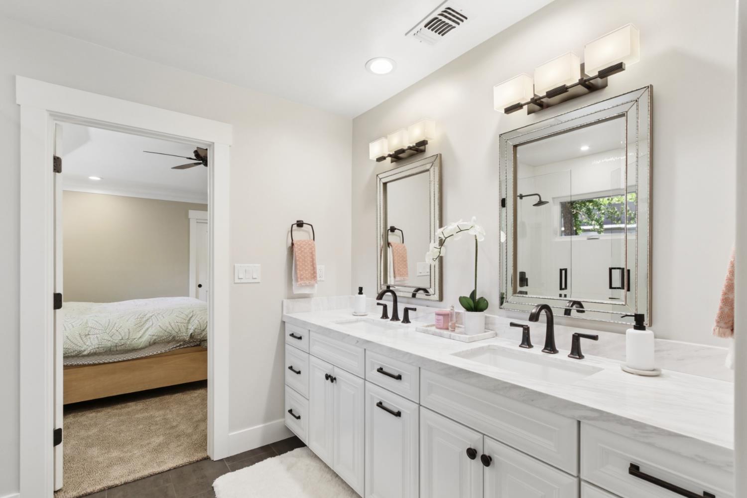 495 Bret Harte Road Sacramento, CA 95864 - Photo 33 of 84 a en suite bathroom with double sink and a mirror