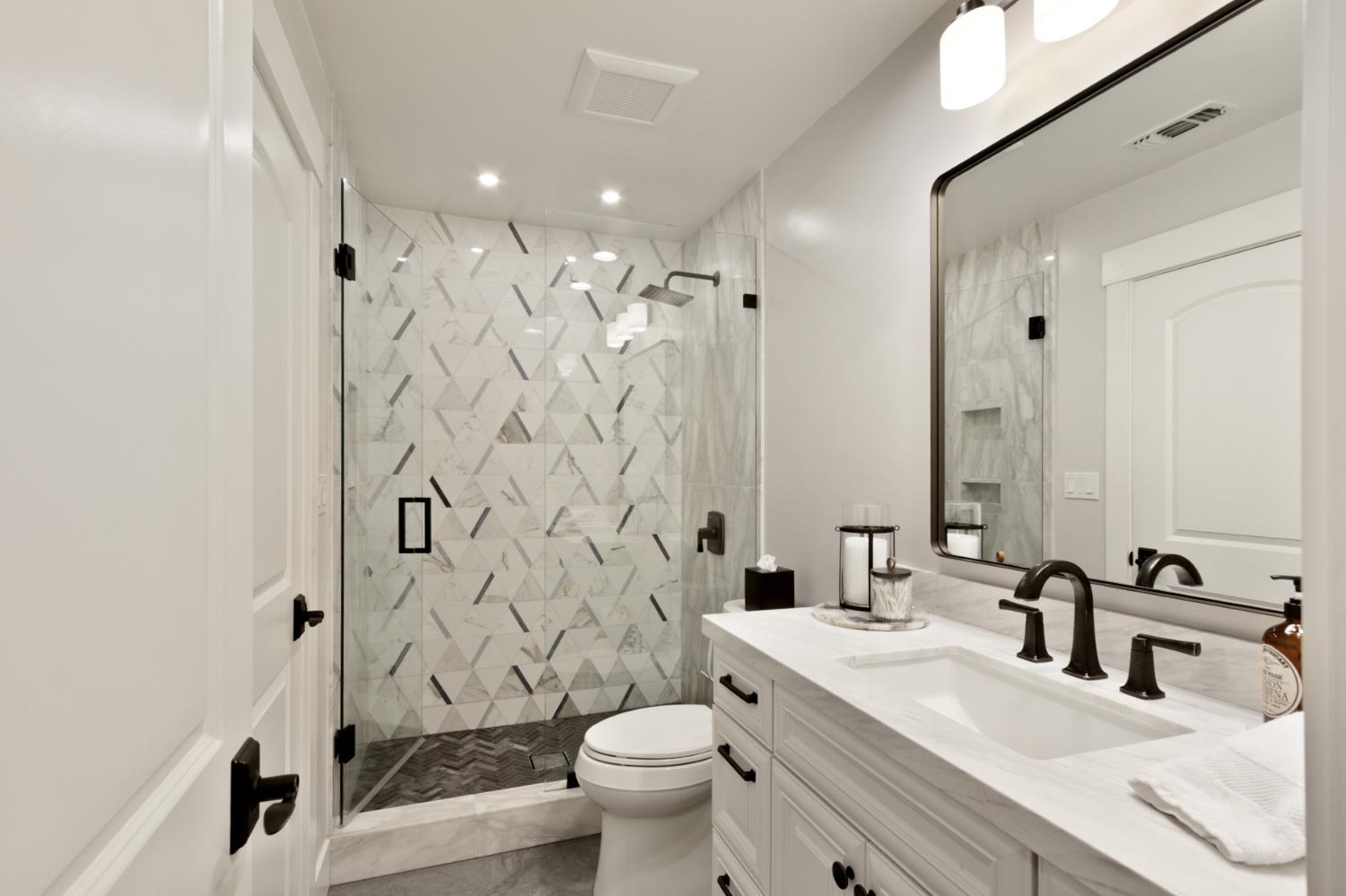 495 Bret Harte Road Sacramento, CA 95864 - Photo 38 of 84 a bathroom with a sink toilet vanity and shower