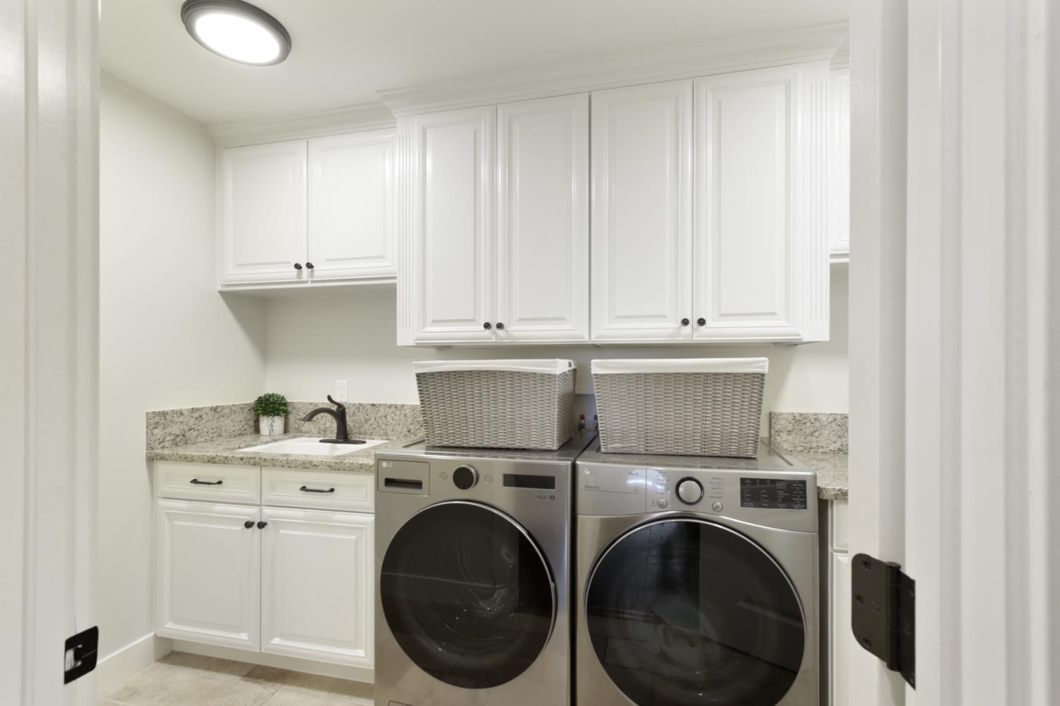 495 Bret Harte Road Sacramento, CA 95864 - Photo 39 of 84 a view of a storage and utility room with washer and dryer