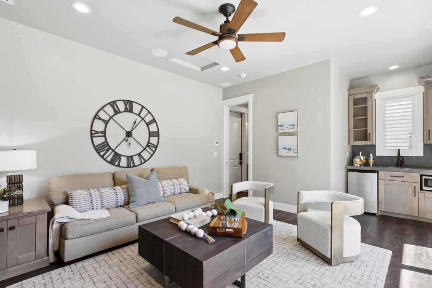 495 Bret Harte Road Sacramento, CA 95864 - Photo 46 of 84 a living room with furniture a clock on wall and a chandelier