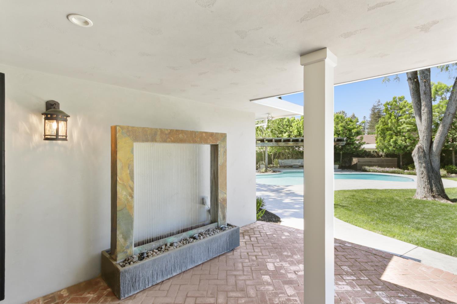 495 Bret Harte Road Sacramento, CA 95864 - Photo 53 of 84 a living room with patio furniture and a floor to ceiling window
