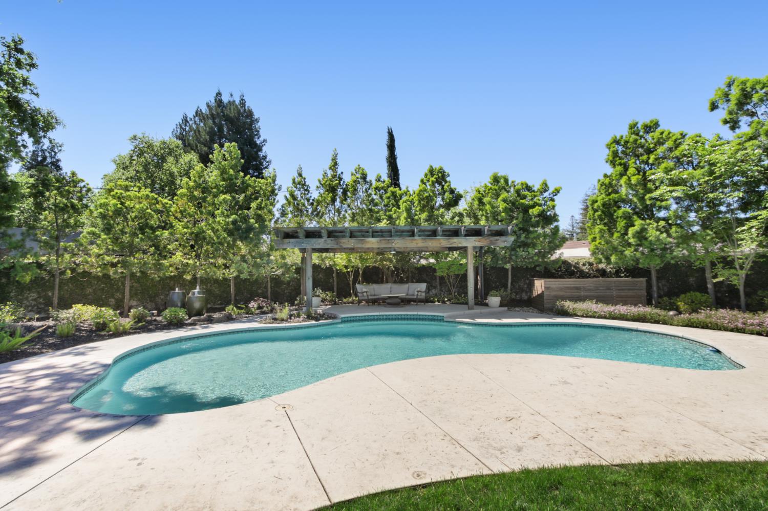 495 Bret Harte Road Sacramento, CA 95864 - Photo 56 of 84 a front view of a house with a yard and trees